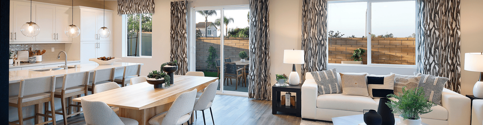 A room with a table chairs and a couch.