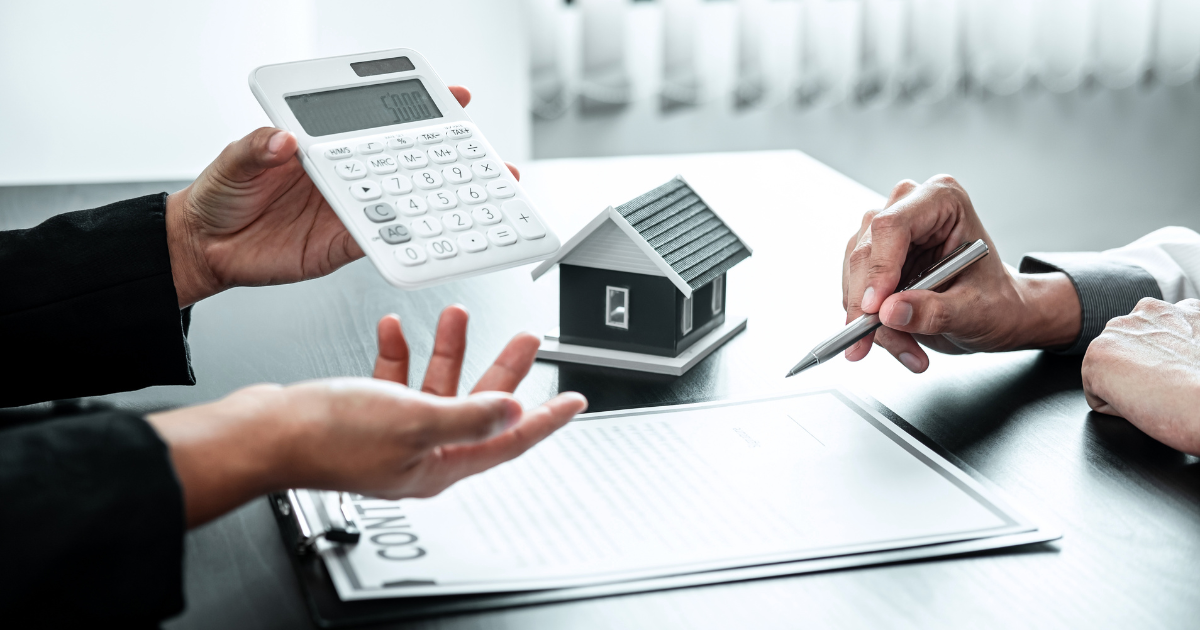 A few people working on a calculator.