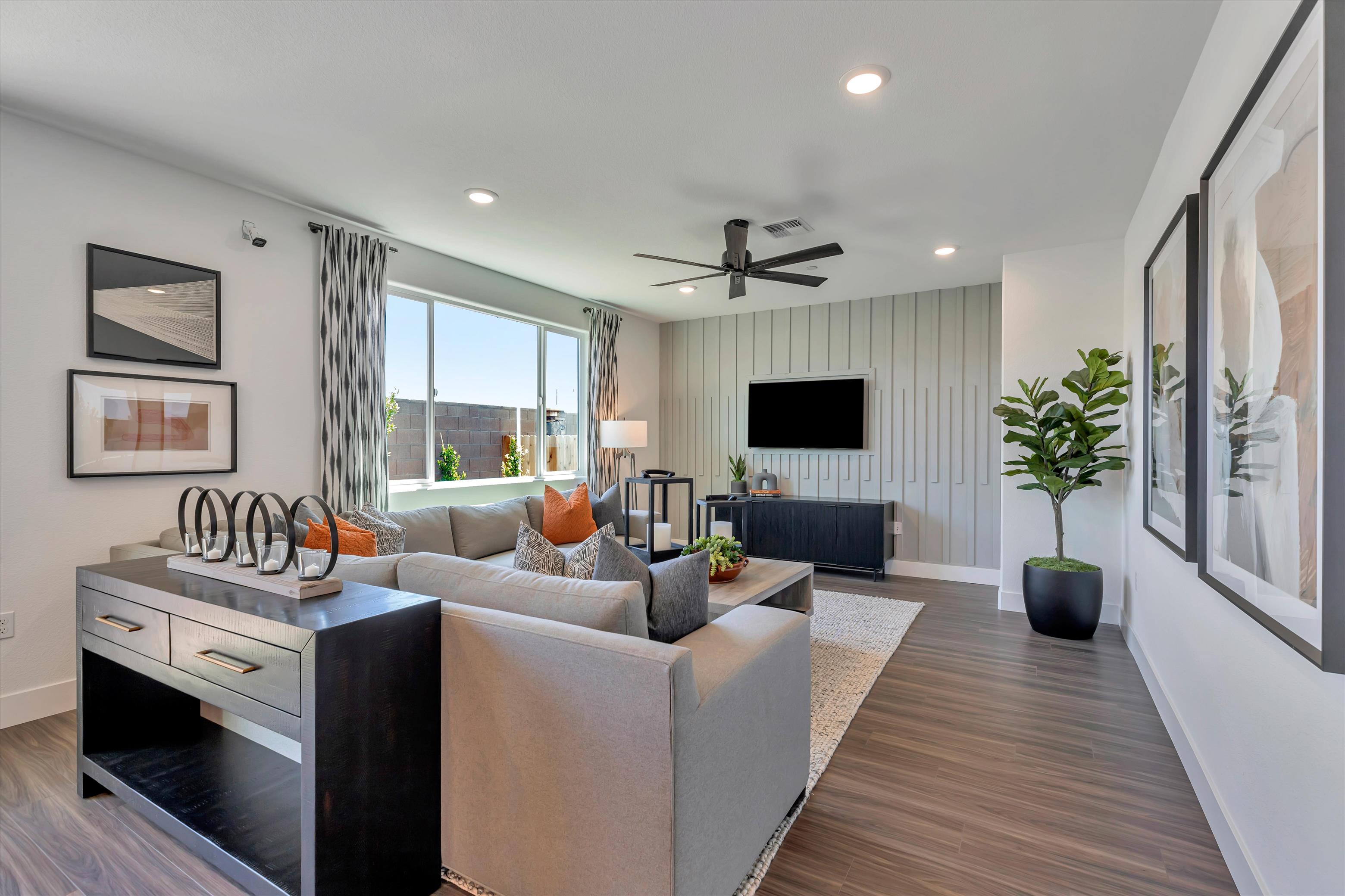 A living room with a tv and couches.