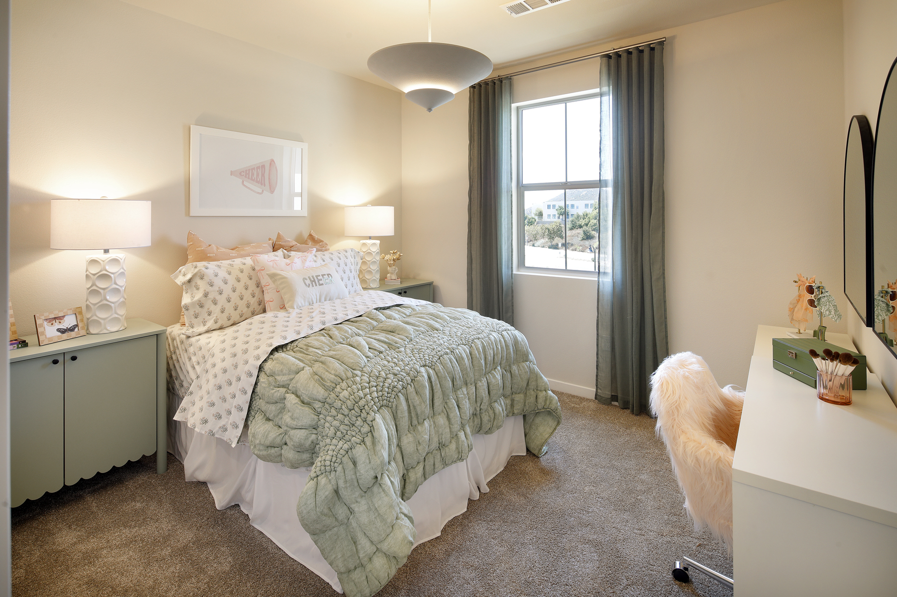 A bedroom with a bed and a chair.