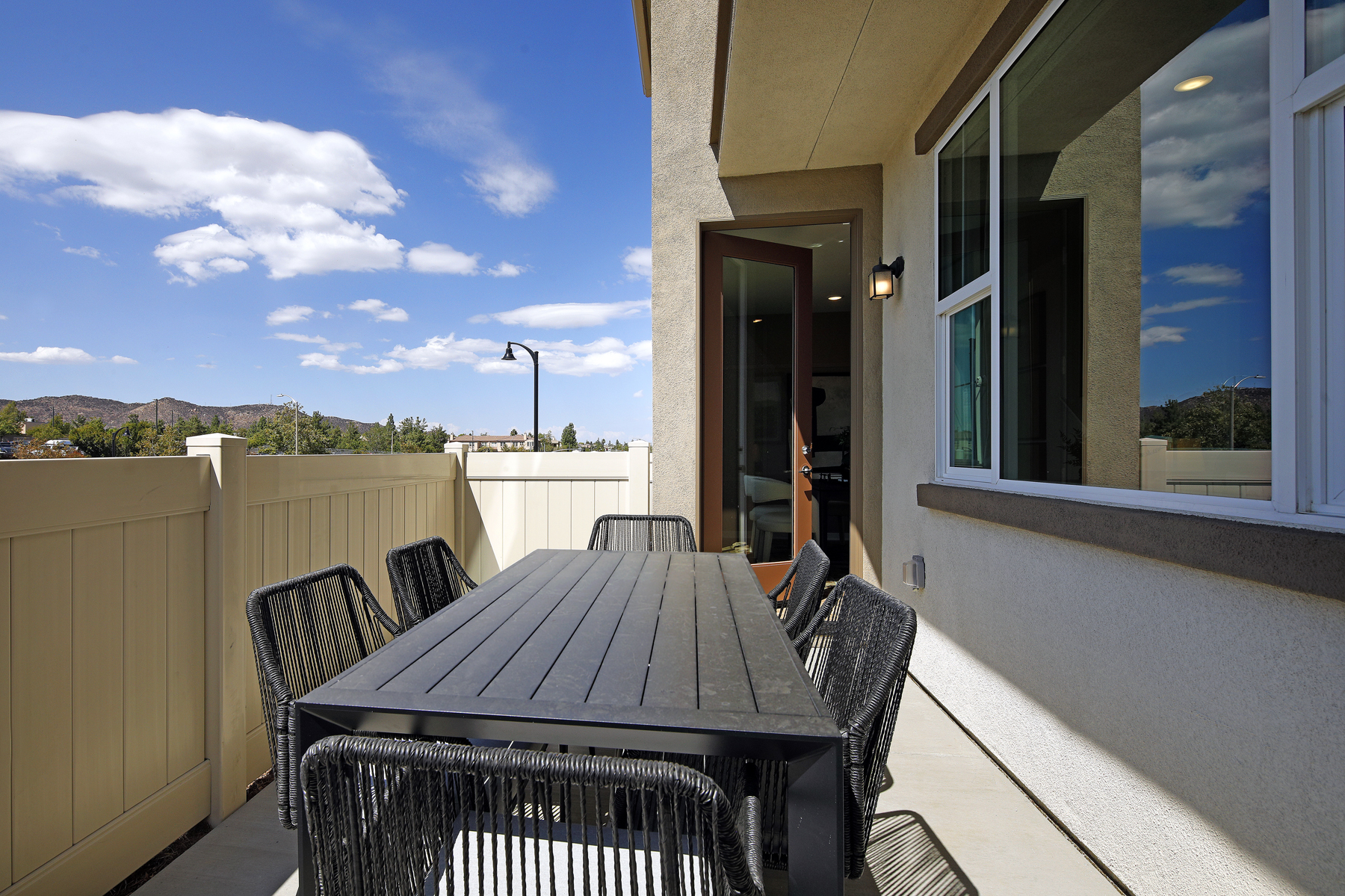 A table and chairs on a deck.