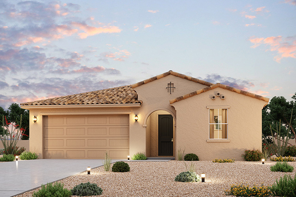 A house with a stone driveway.