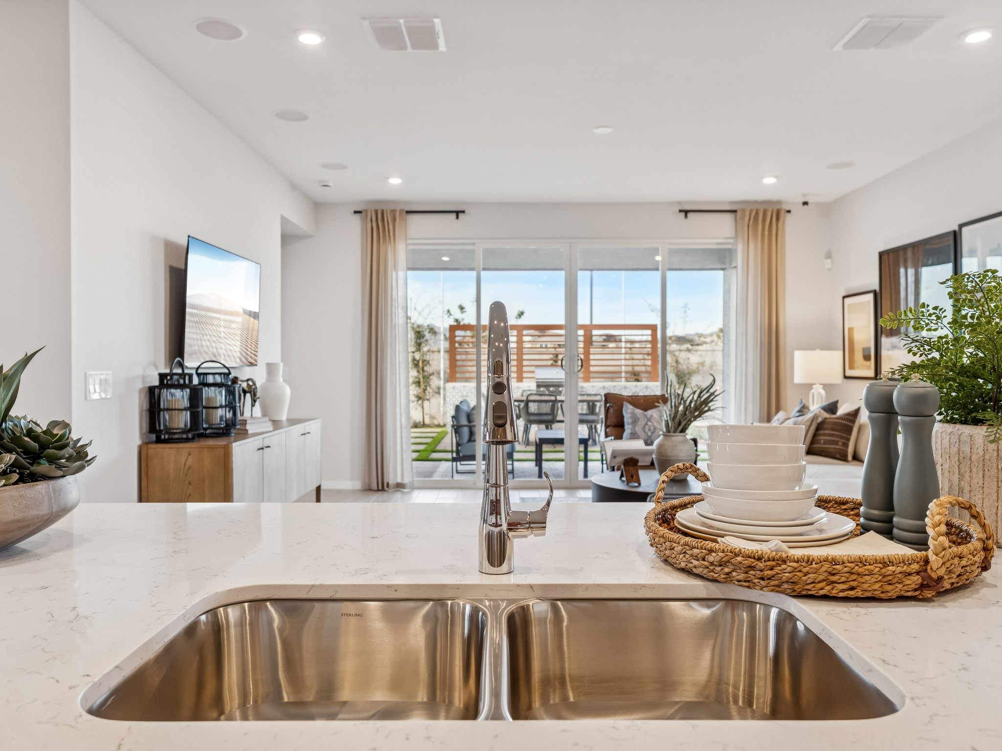 A kitchen with a large glass door.