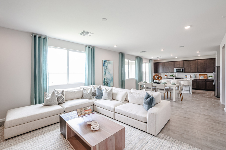 A living room with a couch and a table.