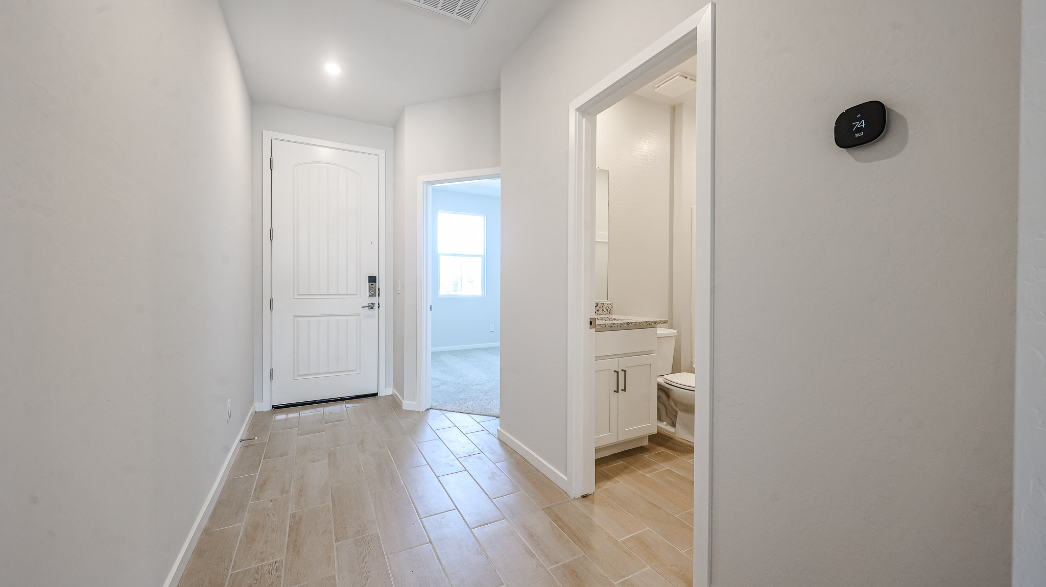 A bathroom with a wood floor.