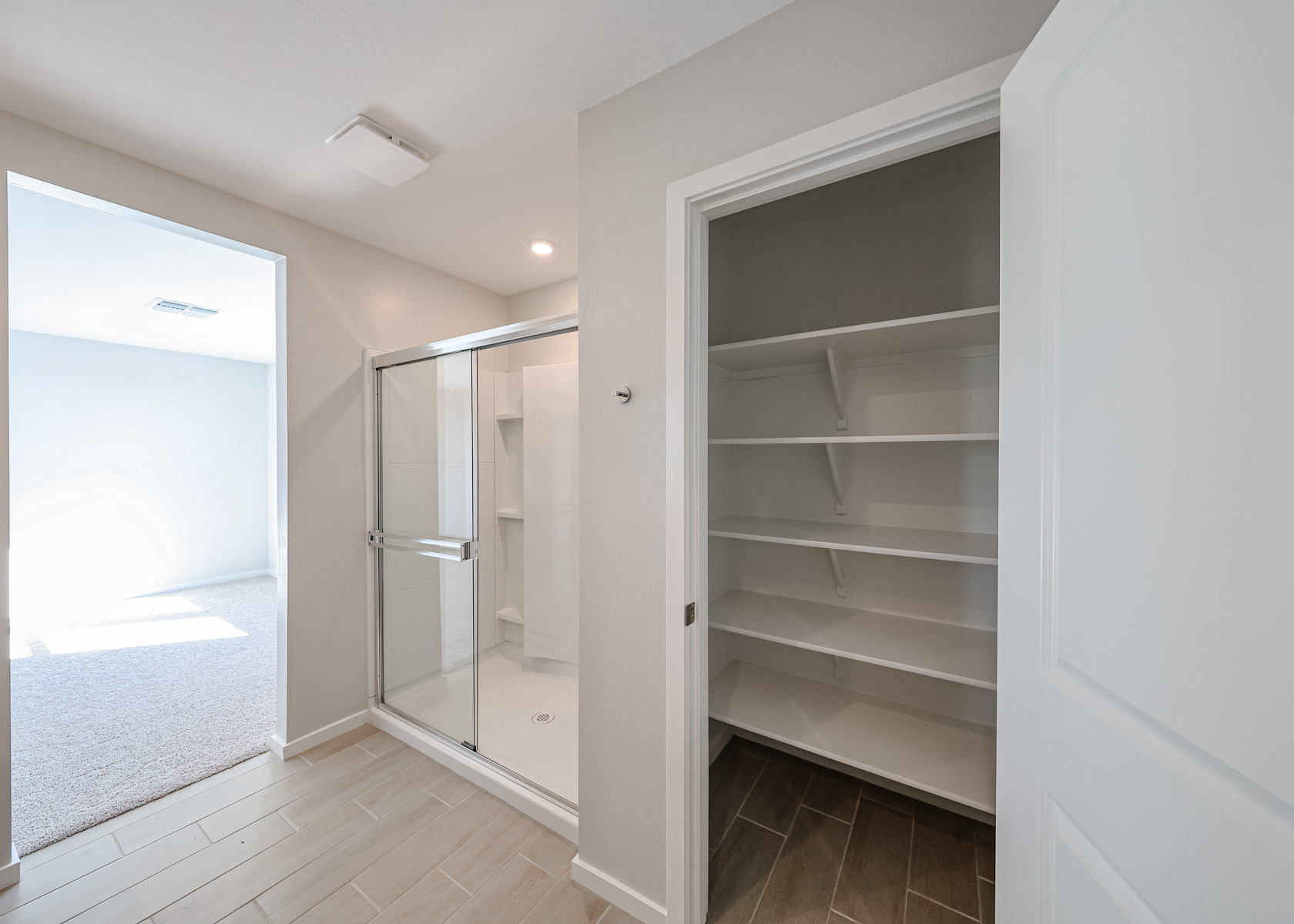A shower unit in a room.