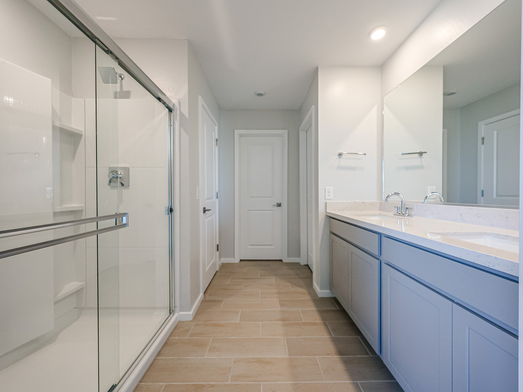 A bathroom with a glass shower.