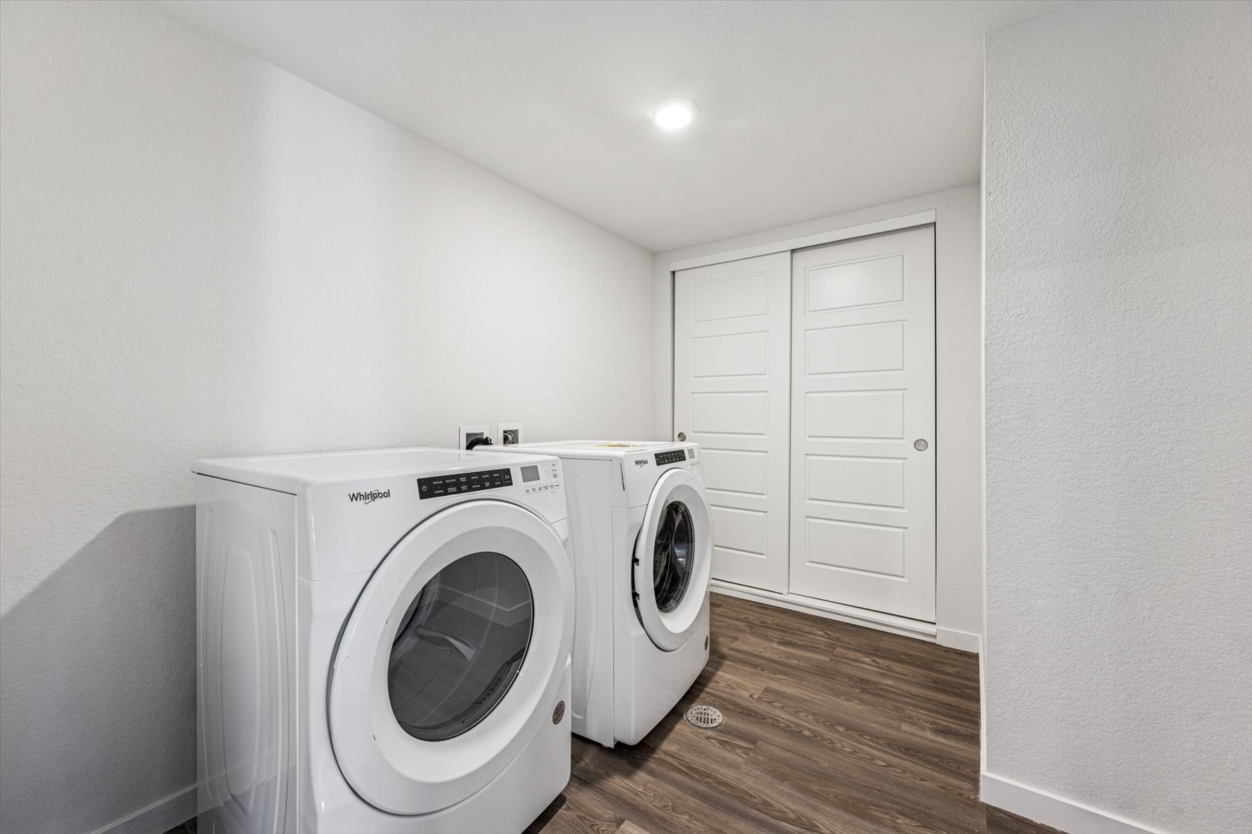 A white washing machine in a room.