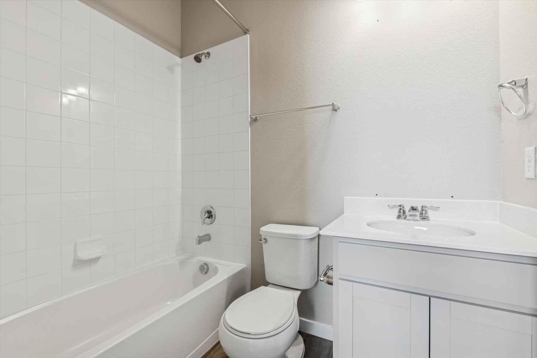 A bathroom with a toilet and sink.
