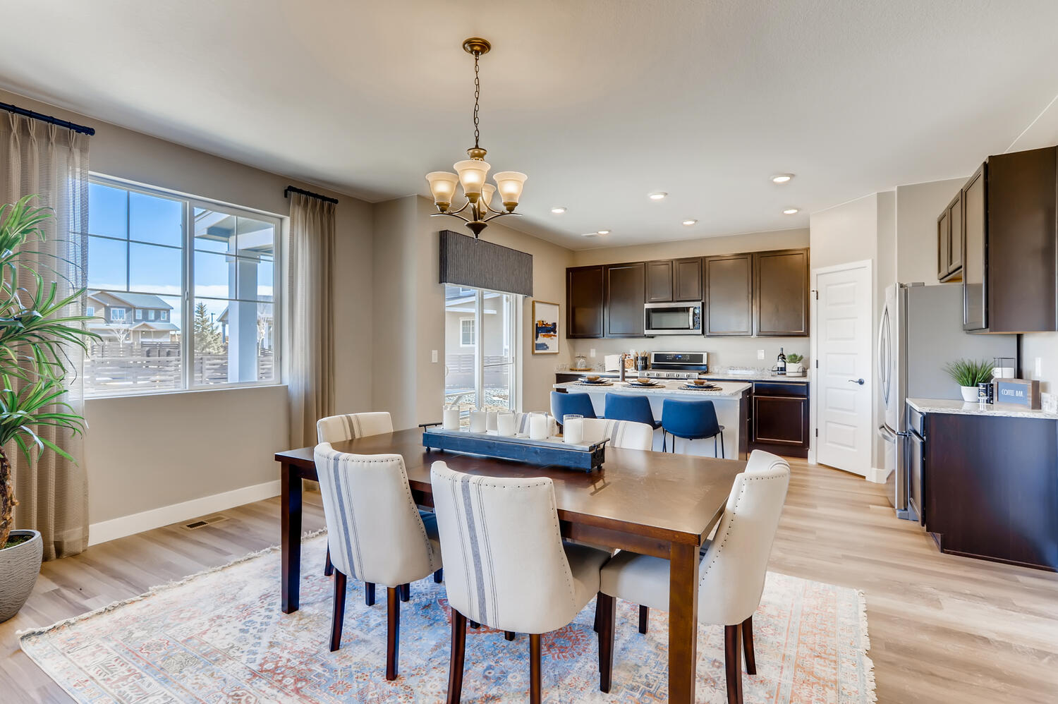A large kitchen with a dining table.