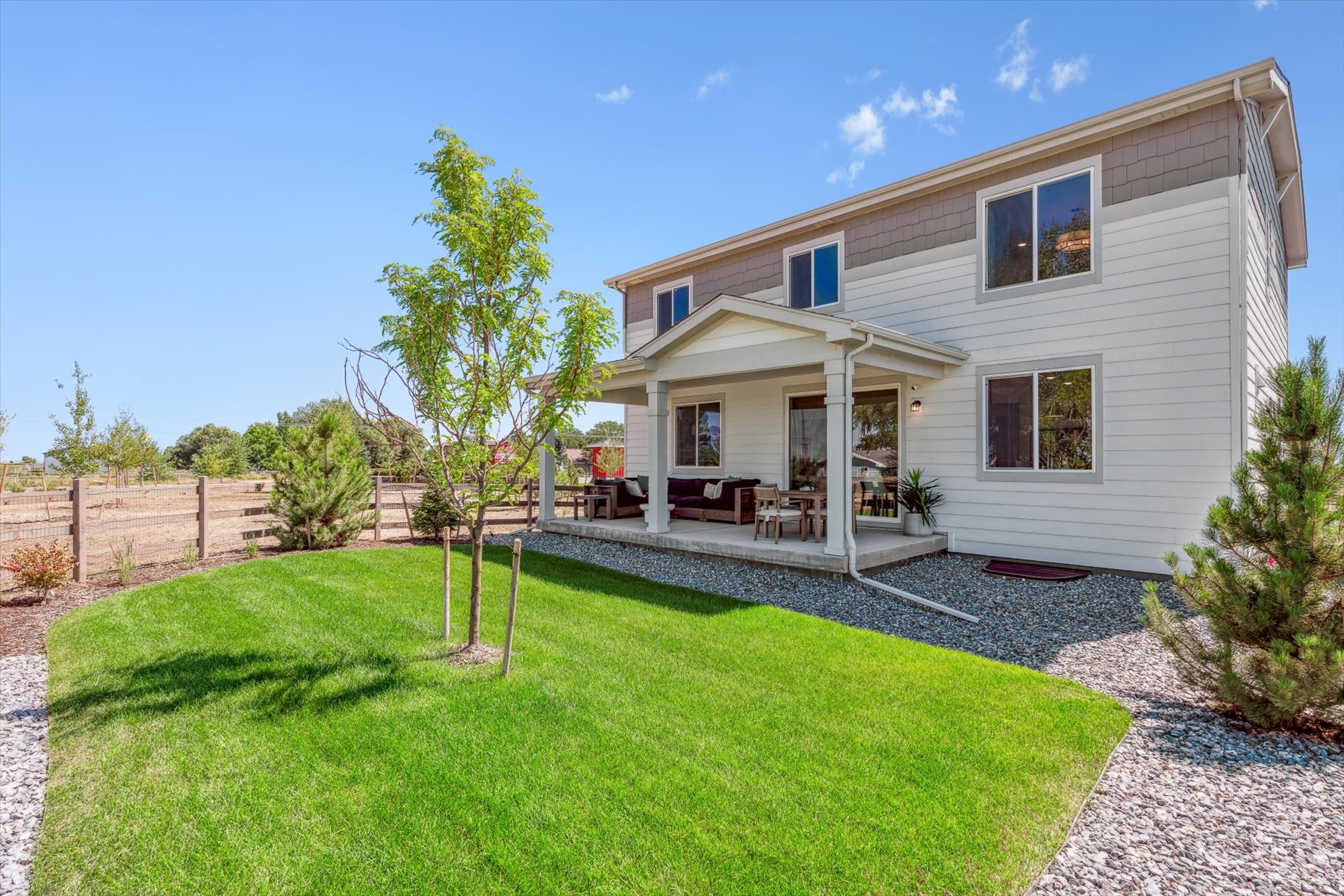 A house with a yard and a fence.