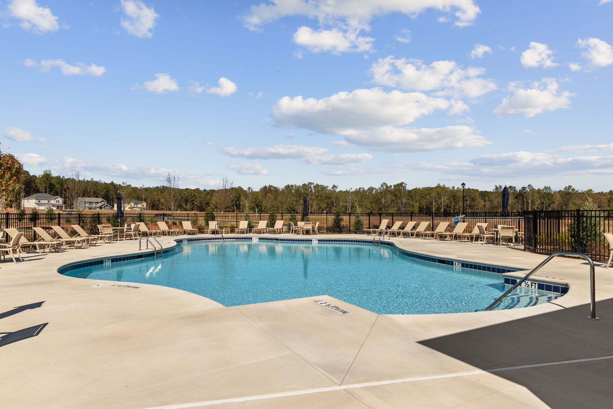 A swimming pool with a fence around it.