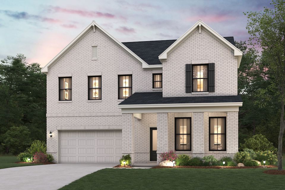 A grey house with a driveway.