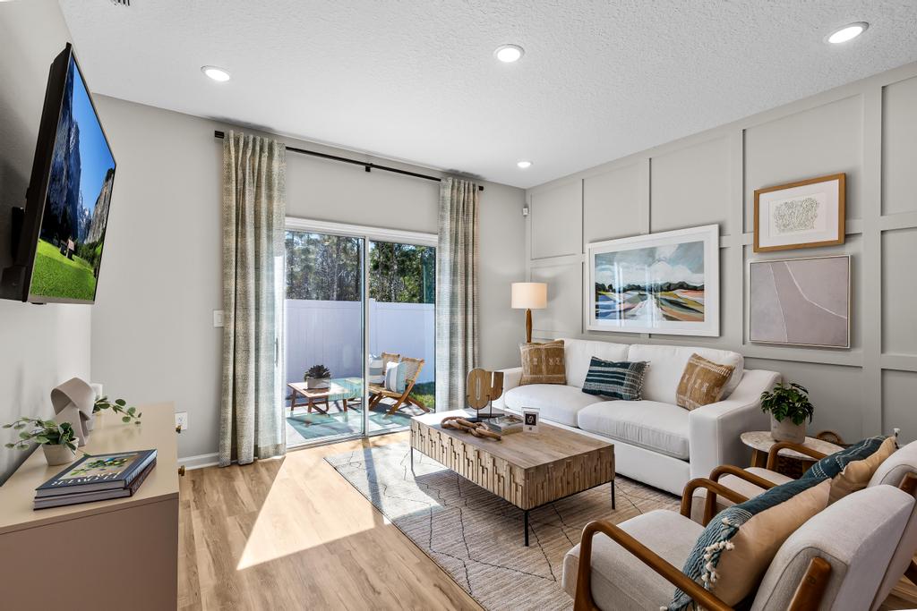 A living room with a tv and couches.