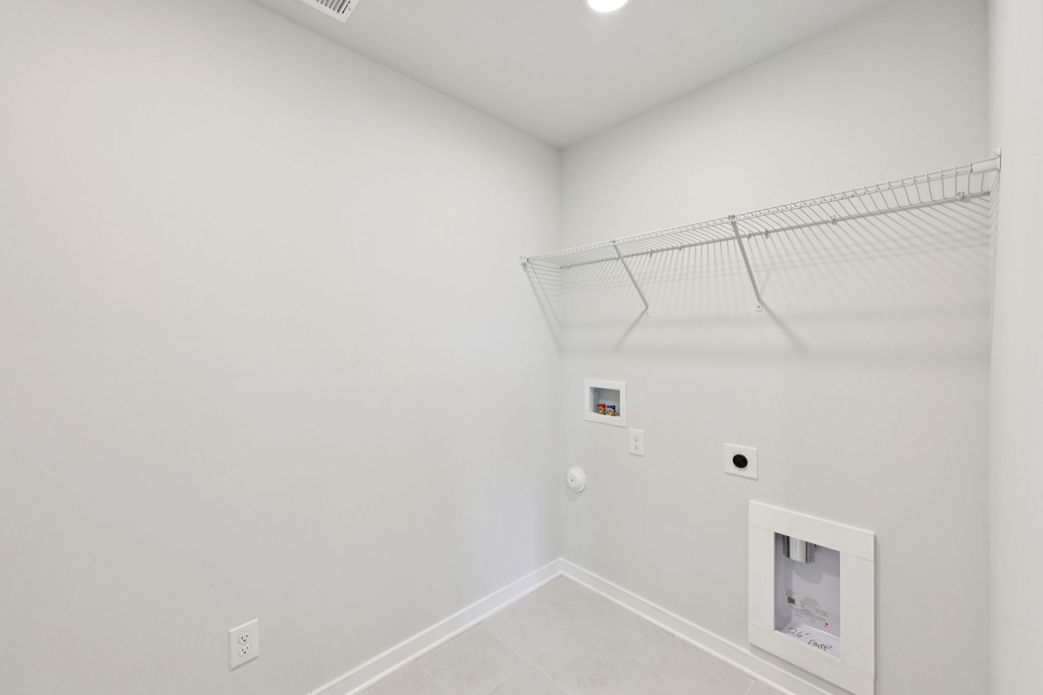 A white wall with a vent and a vent.