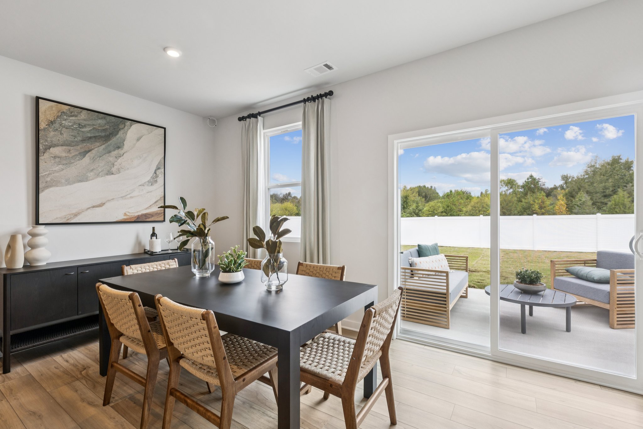 A dining room with a large window.