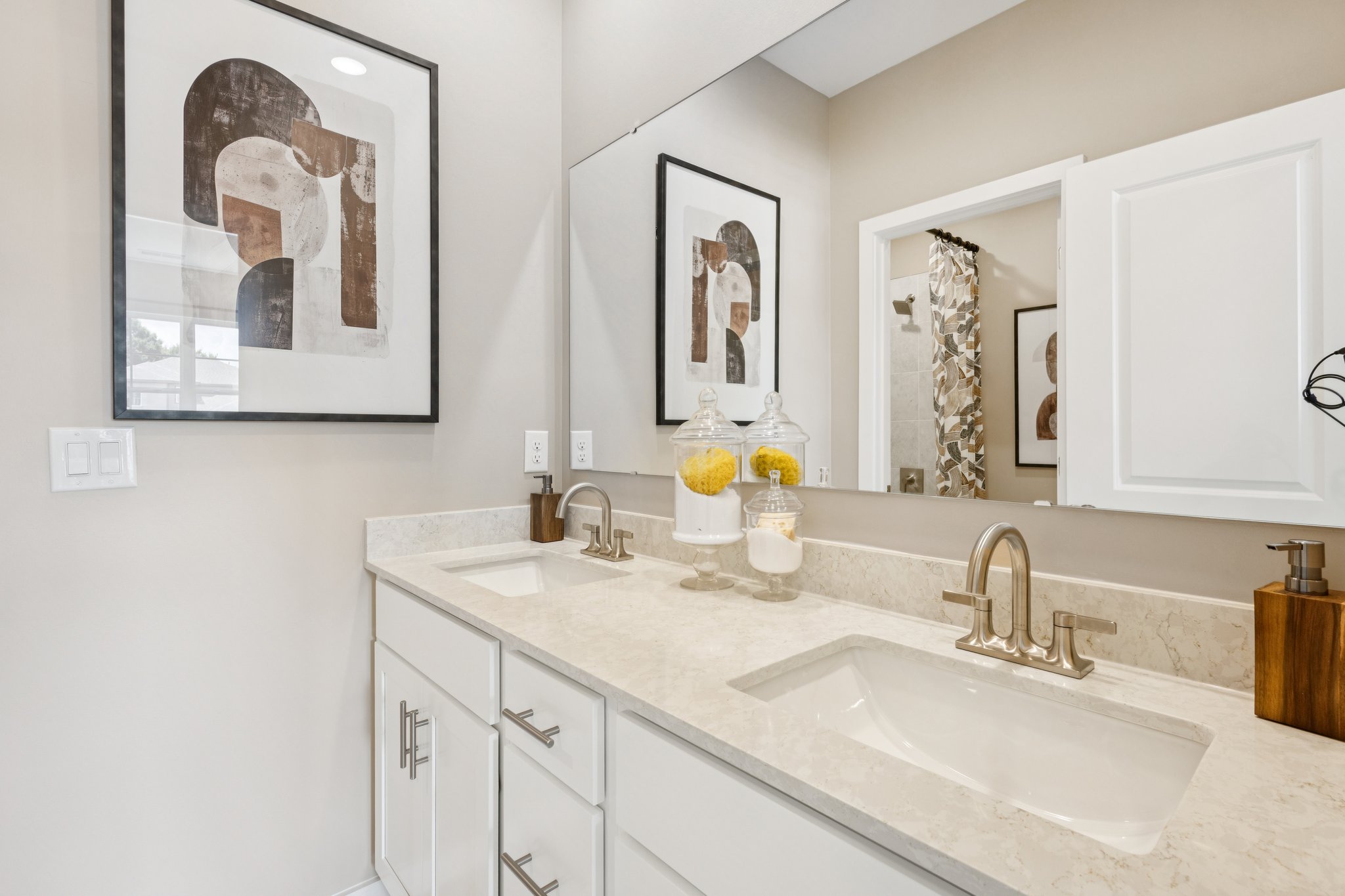A bathroom with a couple of sinks.
