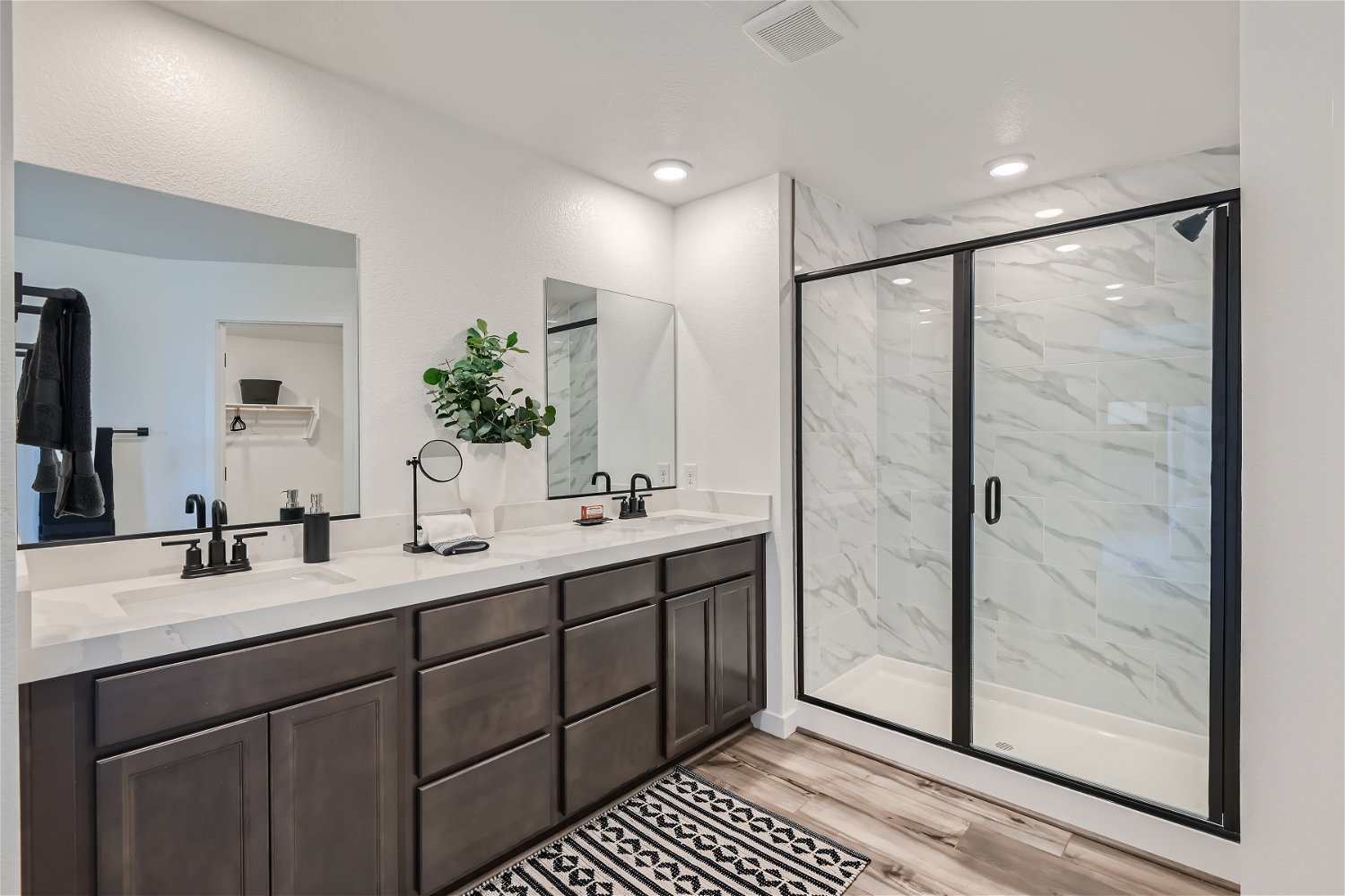 A bathroom with a glass shower.