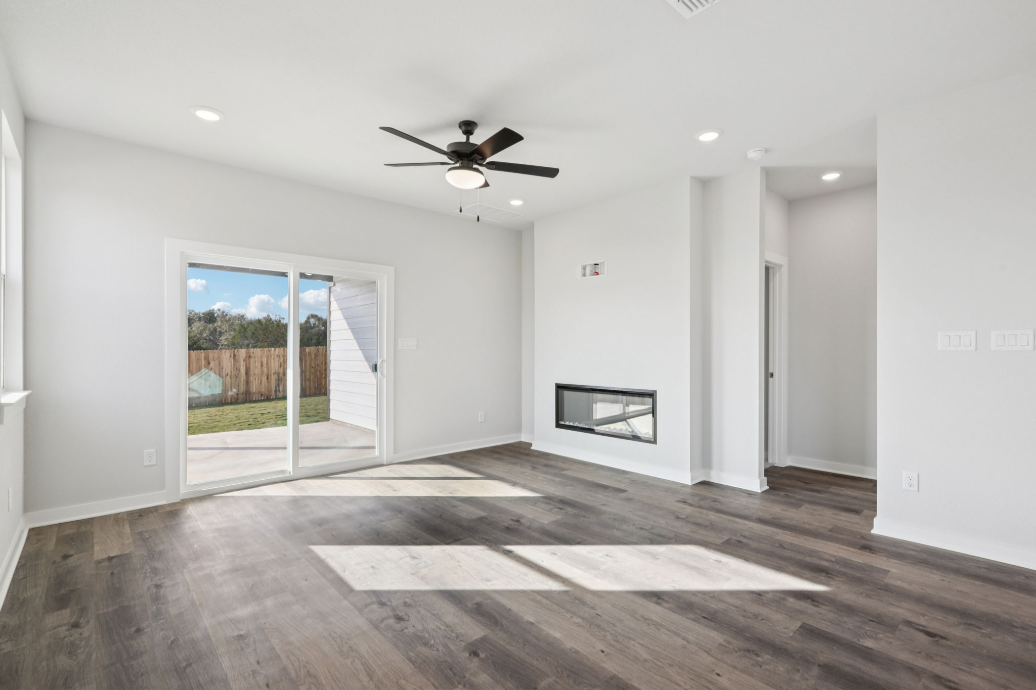 A room with a wood floor and a wood floor with a wood floor.