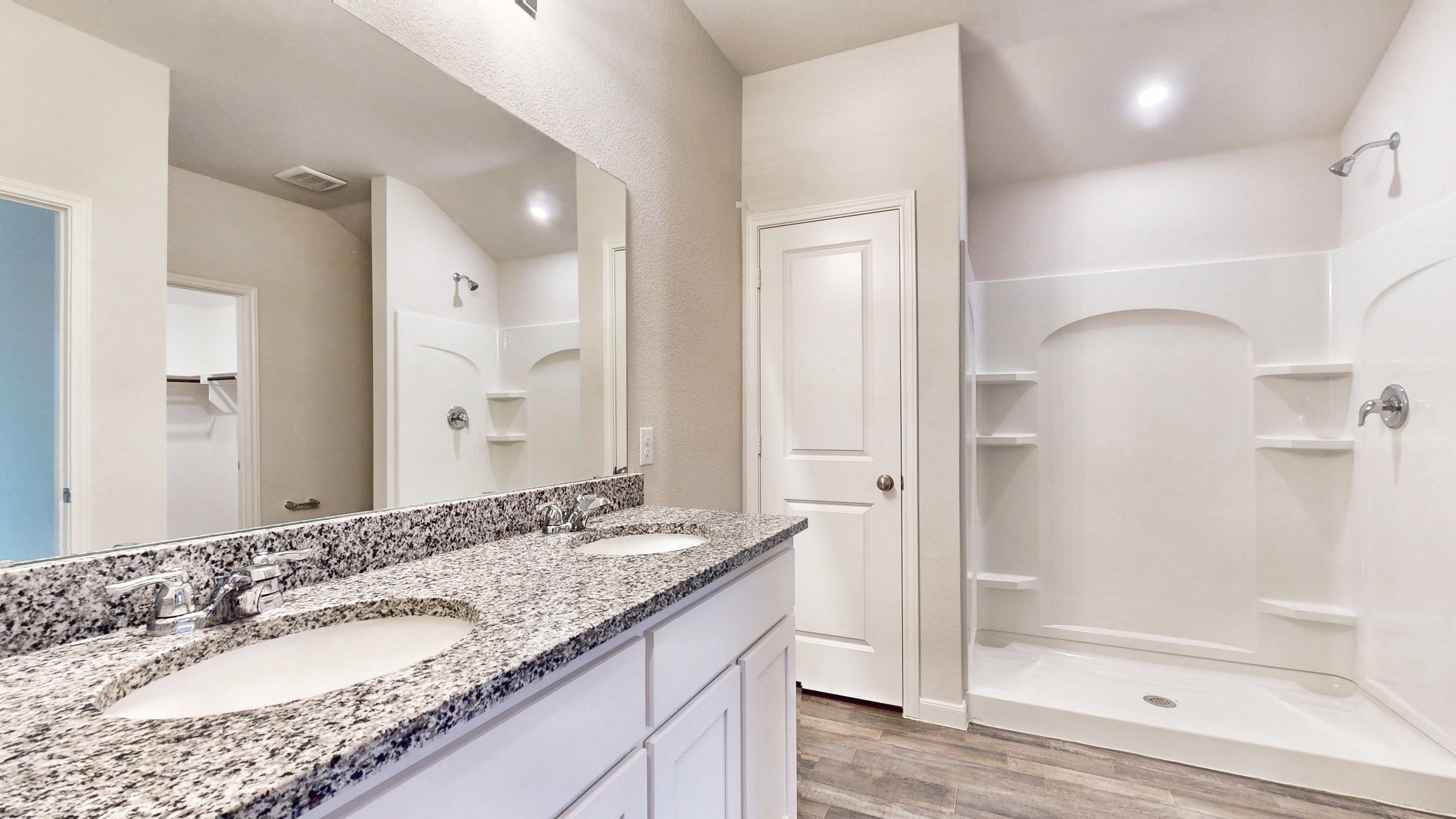 A bathroom with a marble countertop.