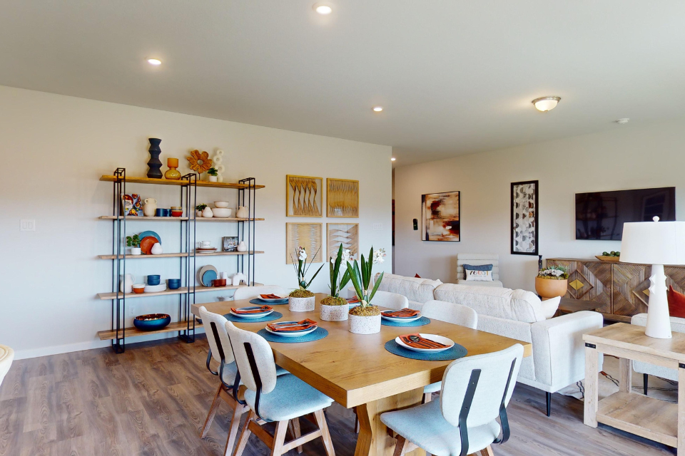 A living room with a dining table.