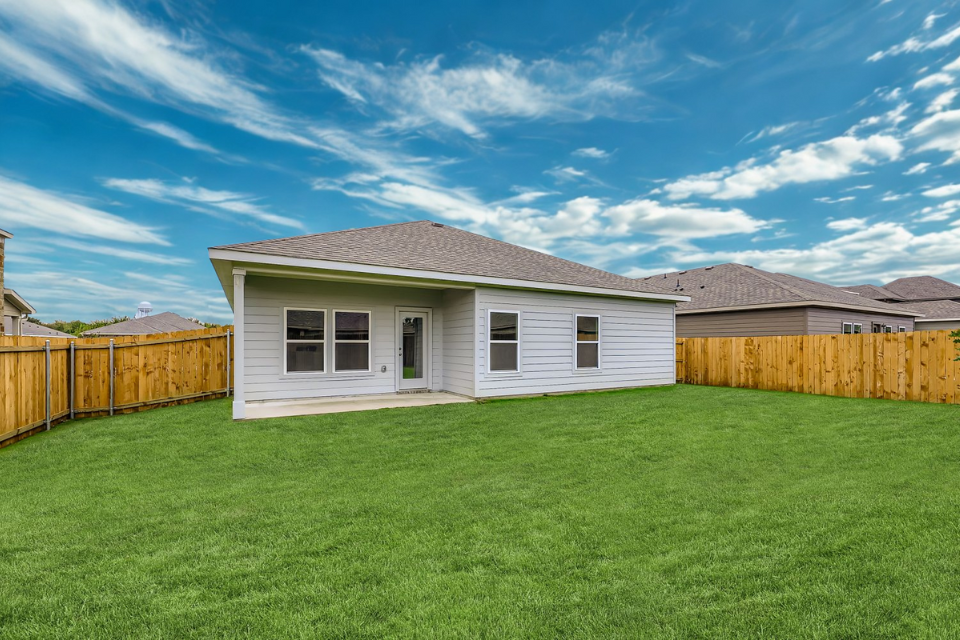 A house with a fence around it.