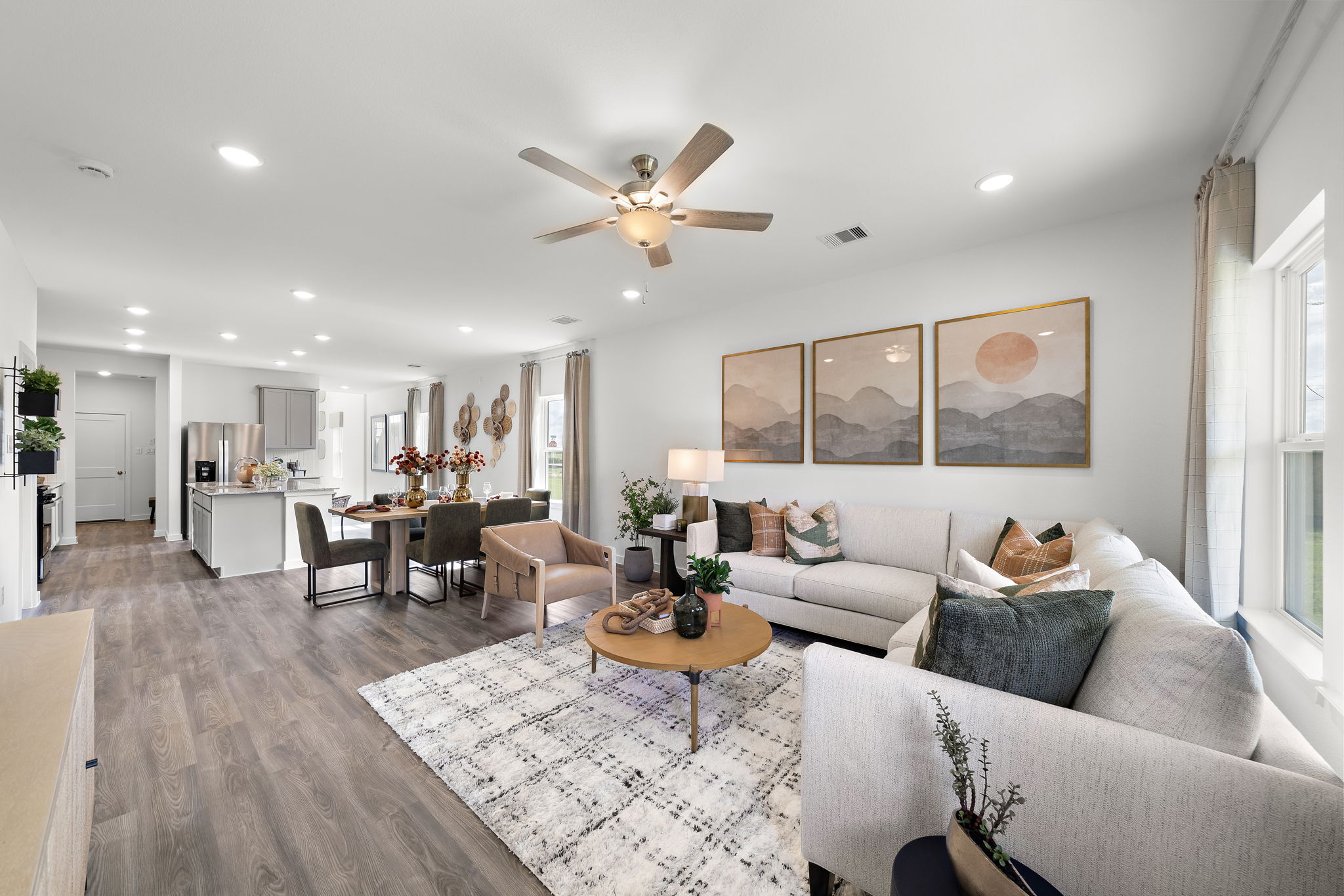 A living room with a chandelier and a couch.