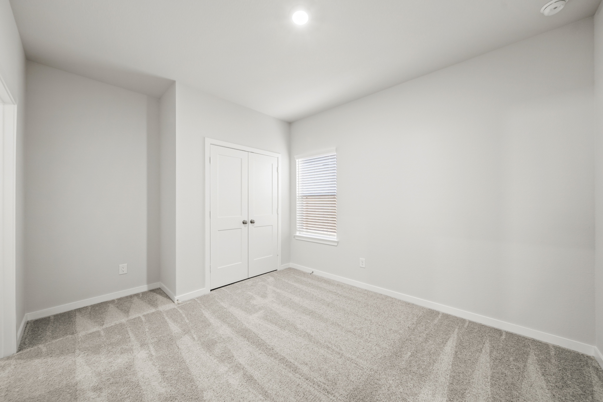 A room with white doors.