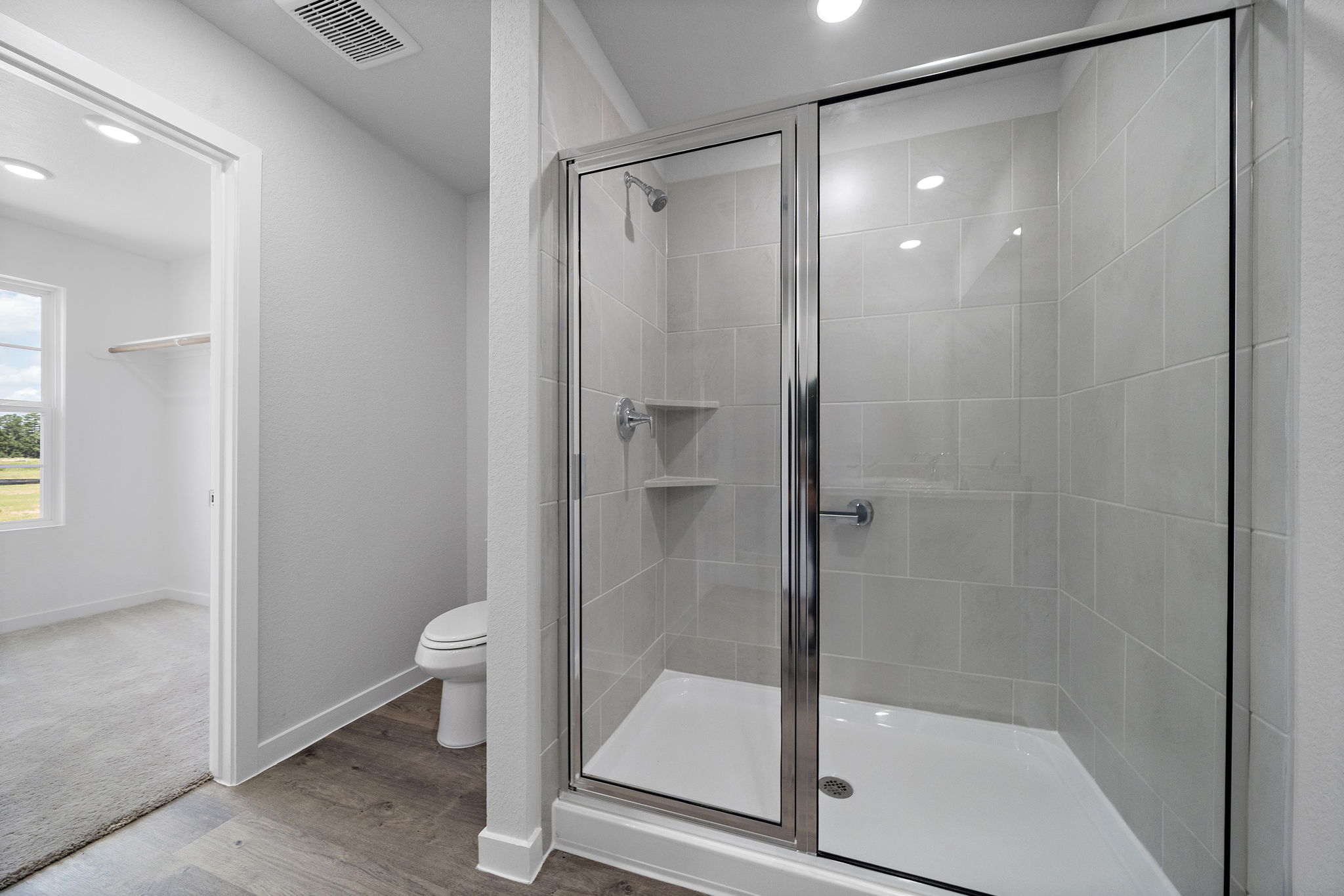 A bathroom with a glass shower.