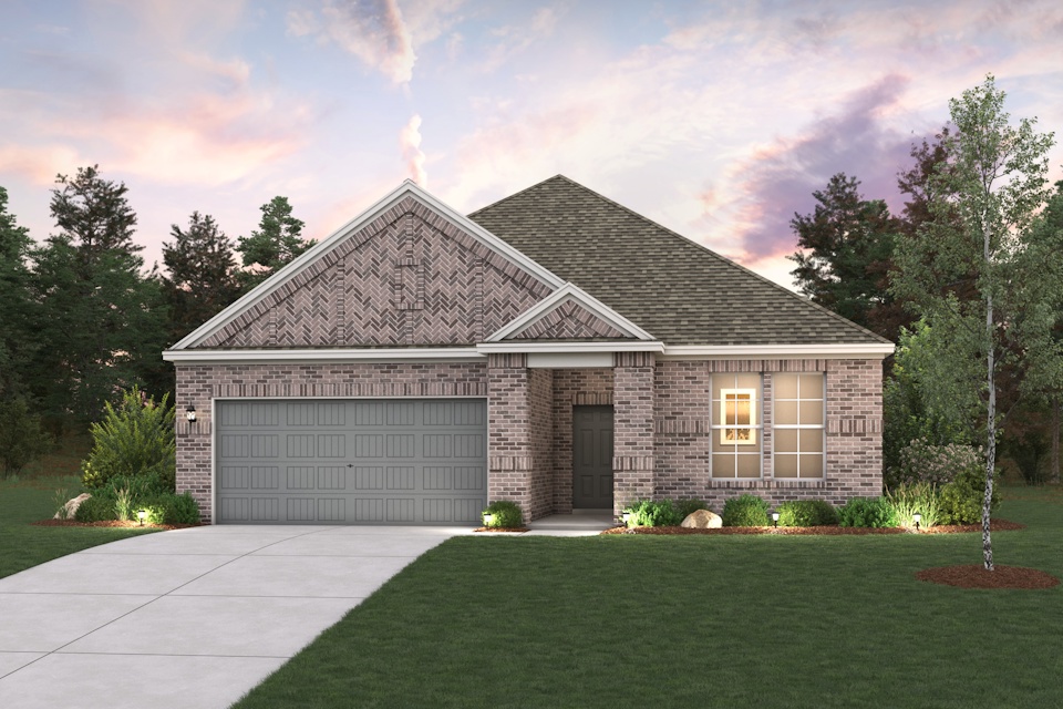 A house with a garage and a lawn in front of it.