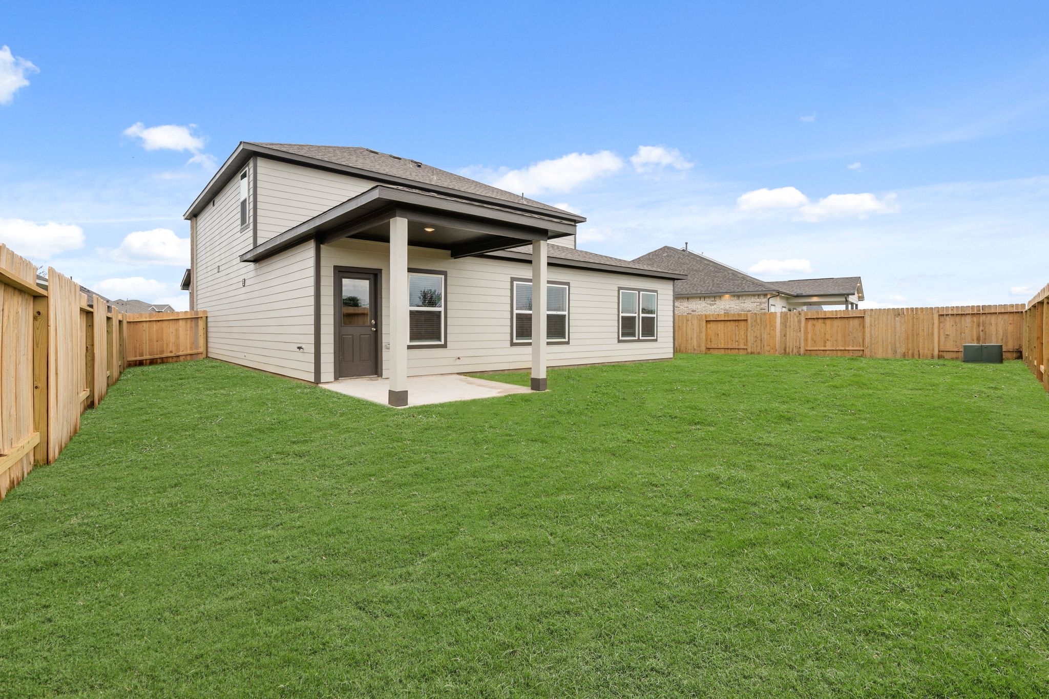 A house with a grass yard.