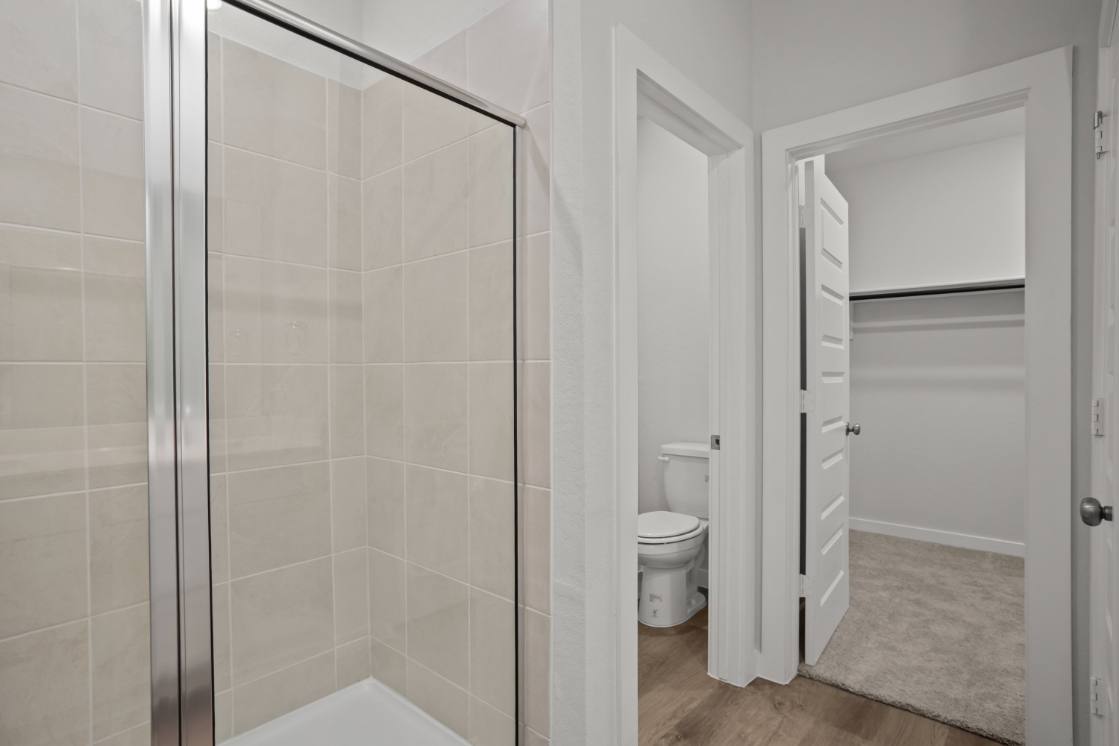 A bathroom with a glass shower.