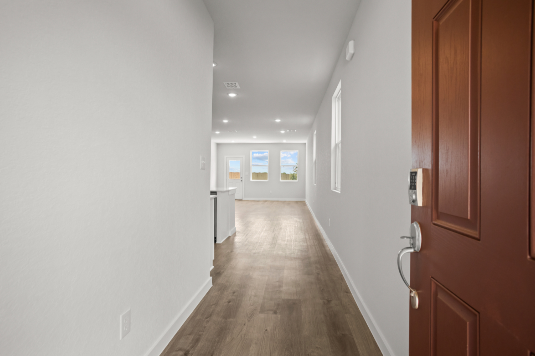 A hallway with wooden doors.