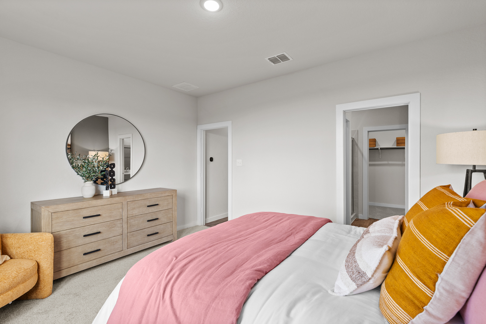 A bedroom with a pink bed and a pink bed.