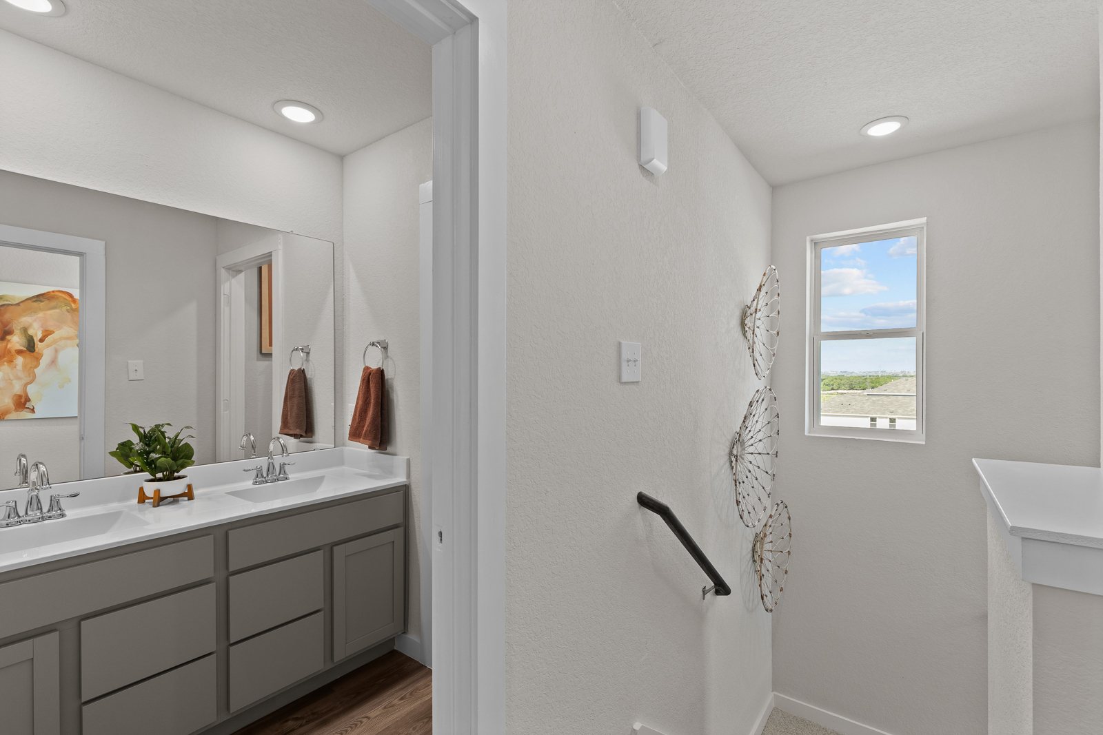 A bathroom with a sink and a mirror.