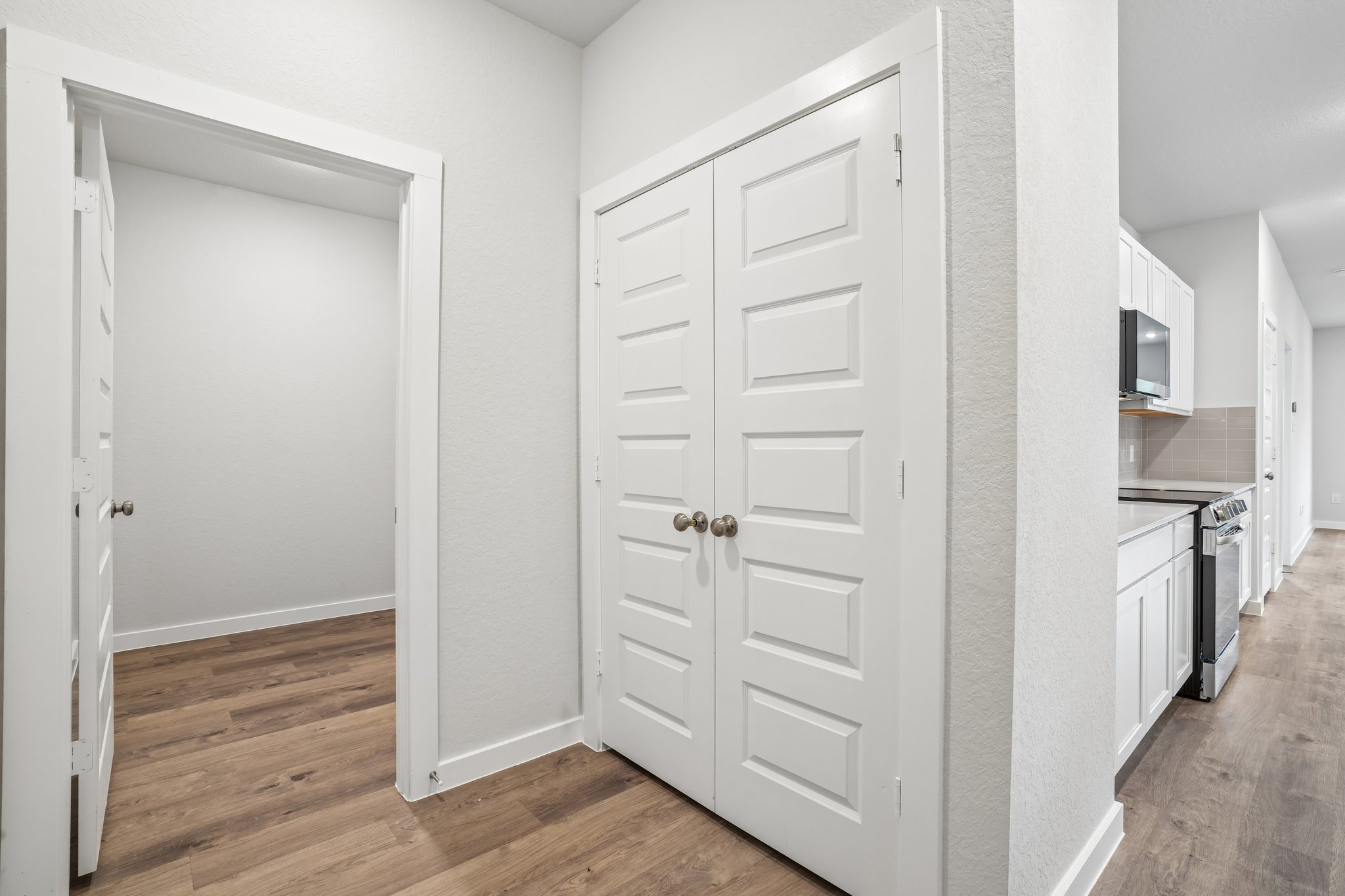 A room with white cabinets.