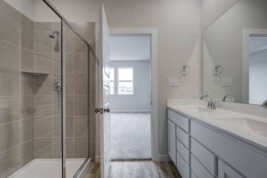 A bathroom with a glass shower.