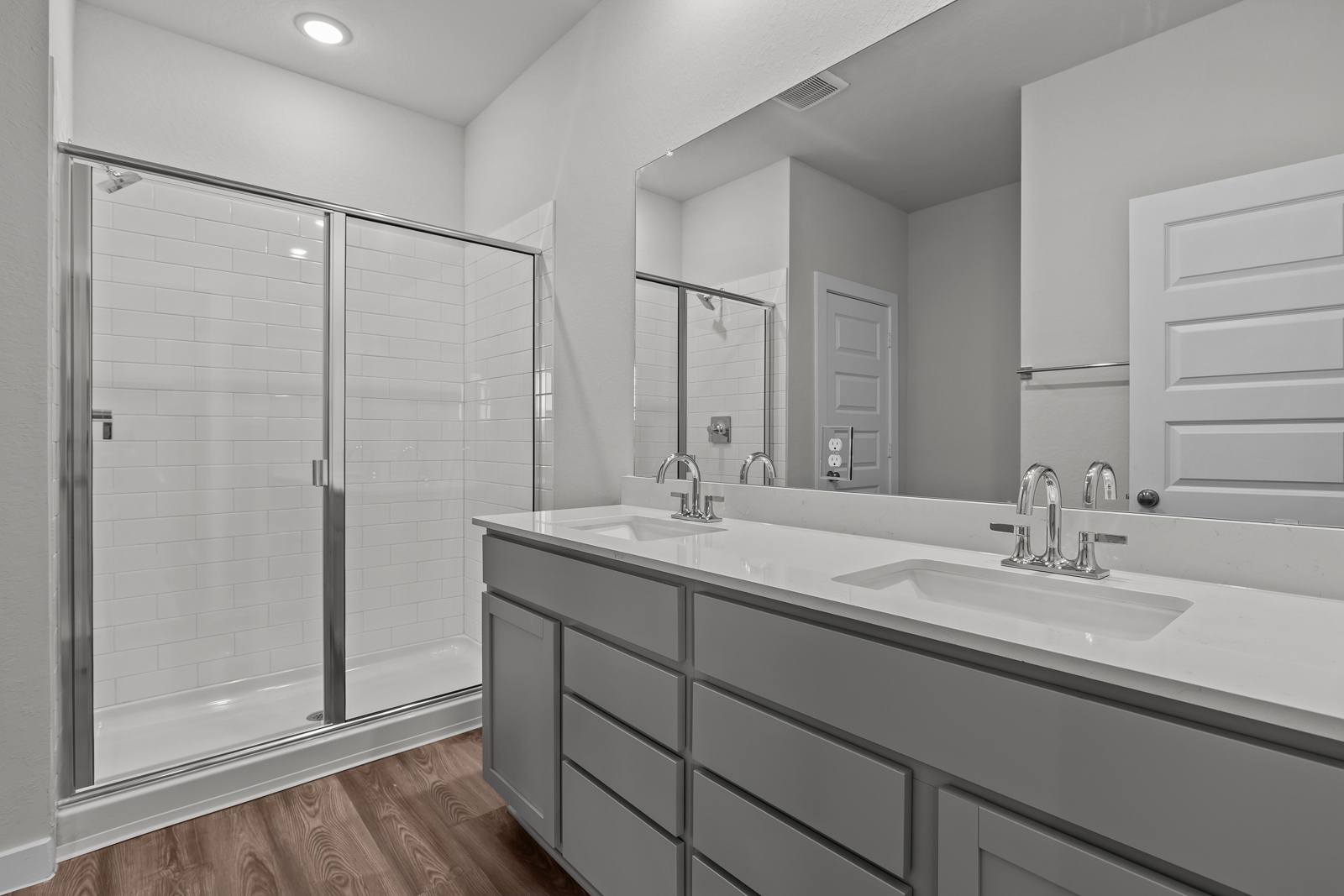 A bathroom with a glass shower.