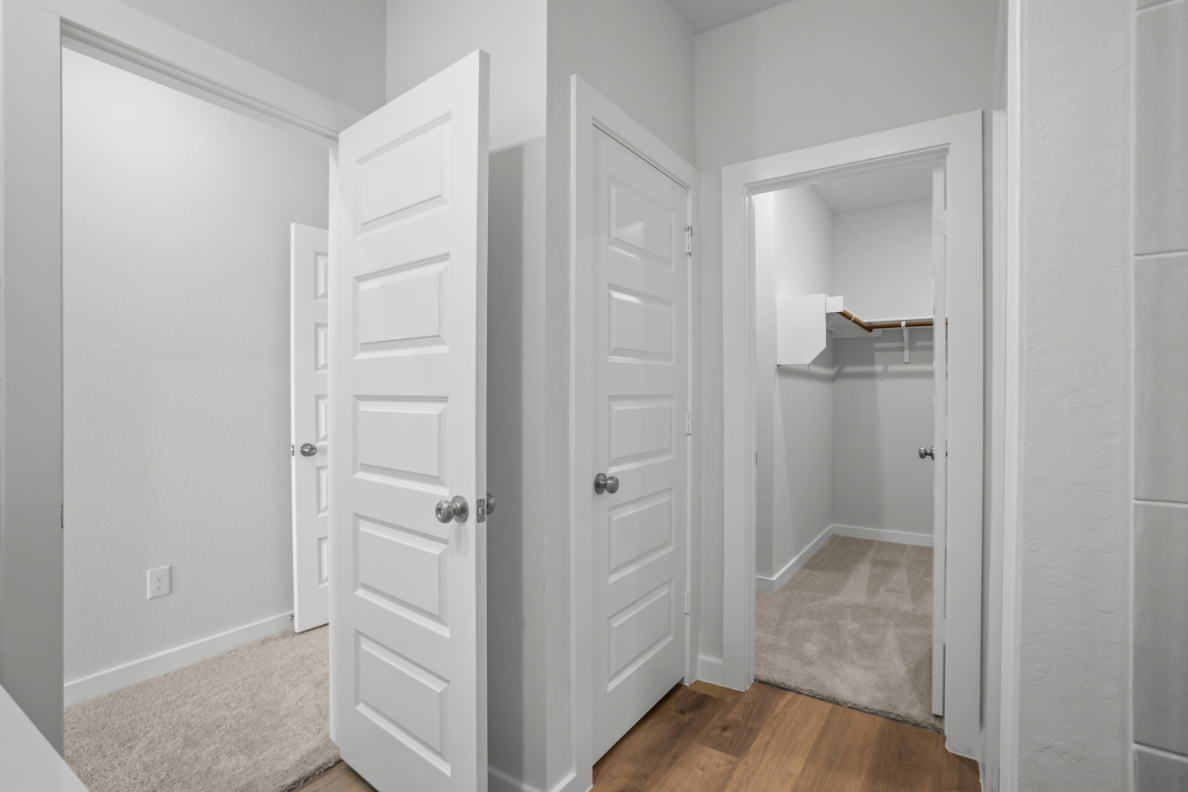 A white closet in a room.