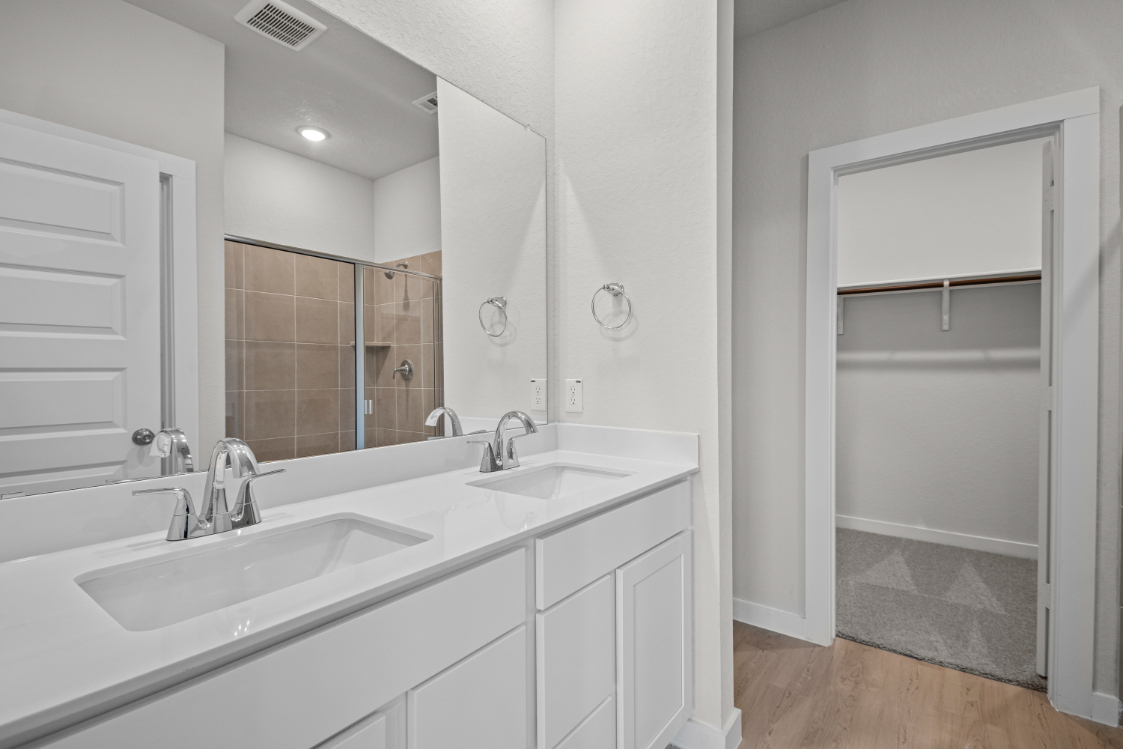 A bathroom with a glass shower.