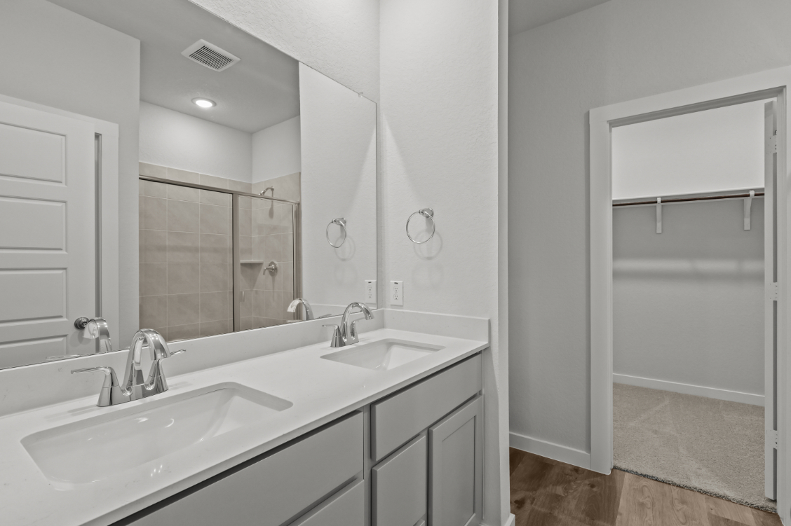 A bathroom with a glass shower.