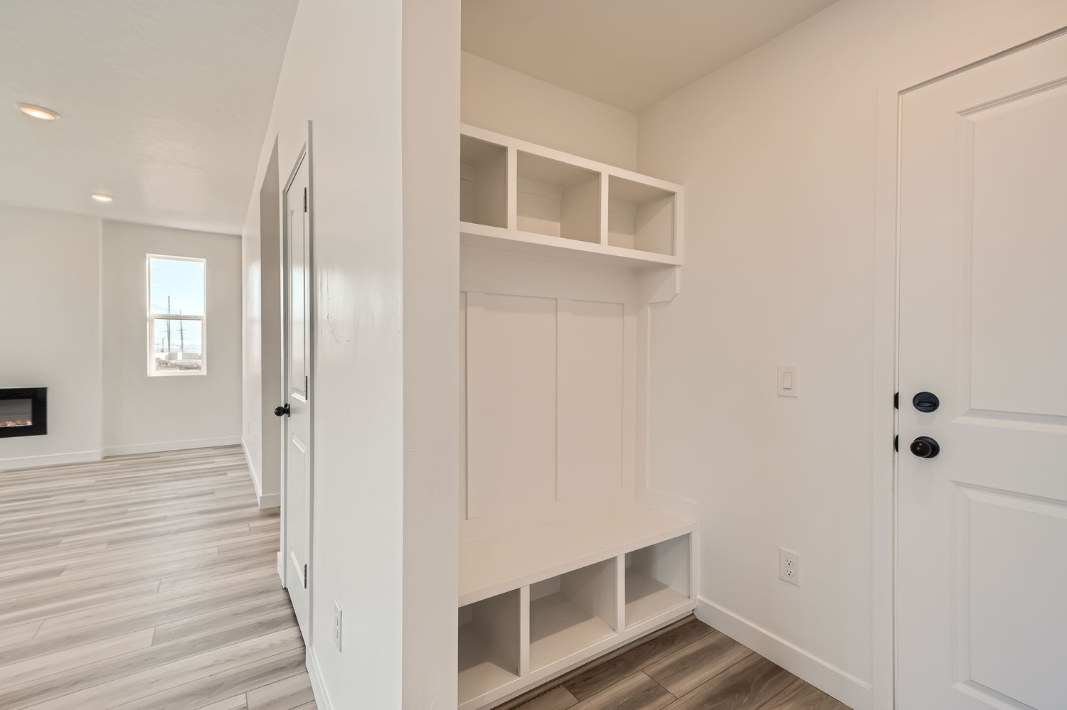 A room with white cabinets.