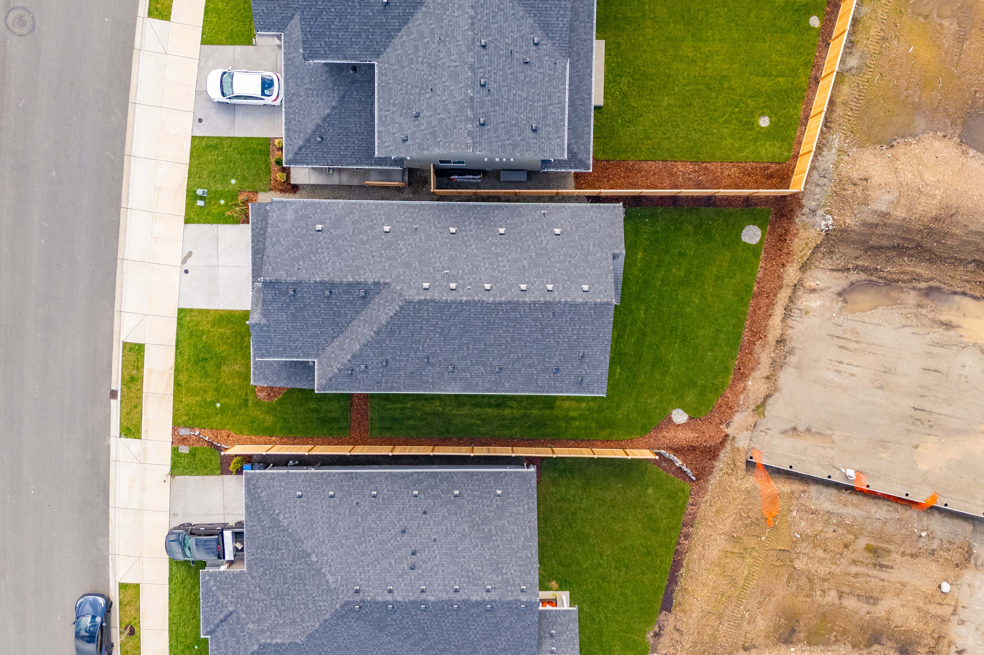 A large area with a pool and a building in the background.