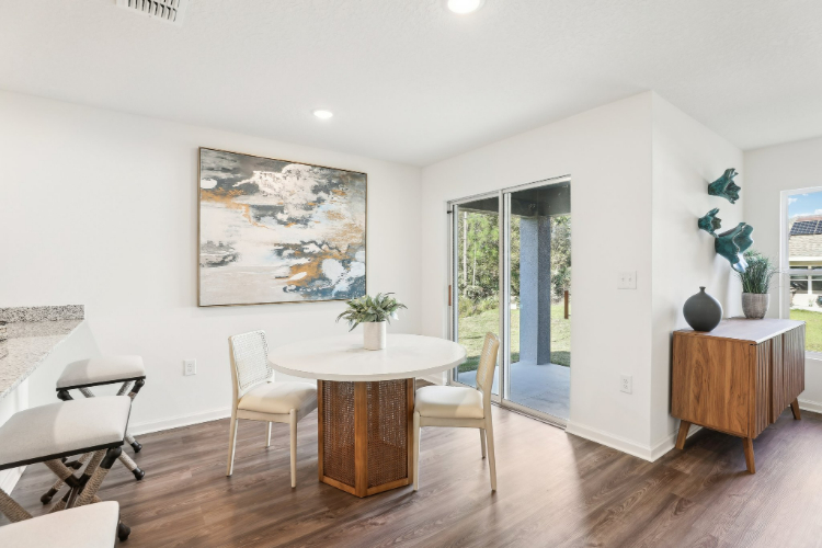 A room with a table and chairs.