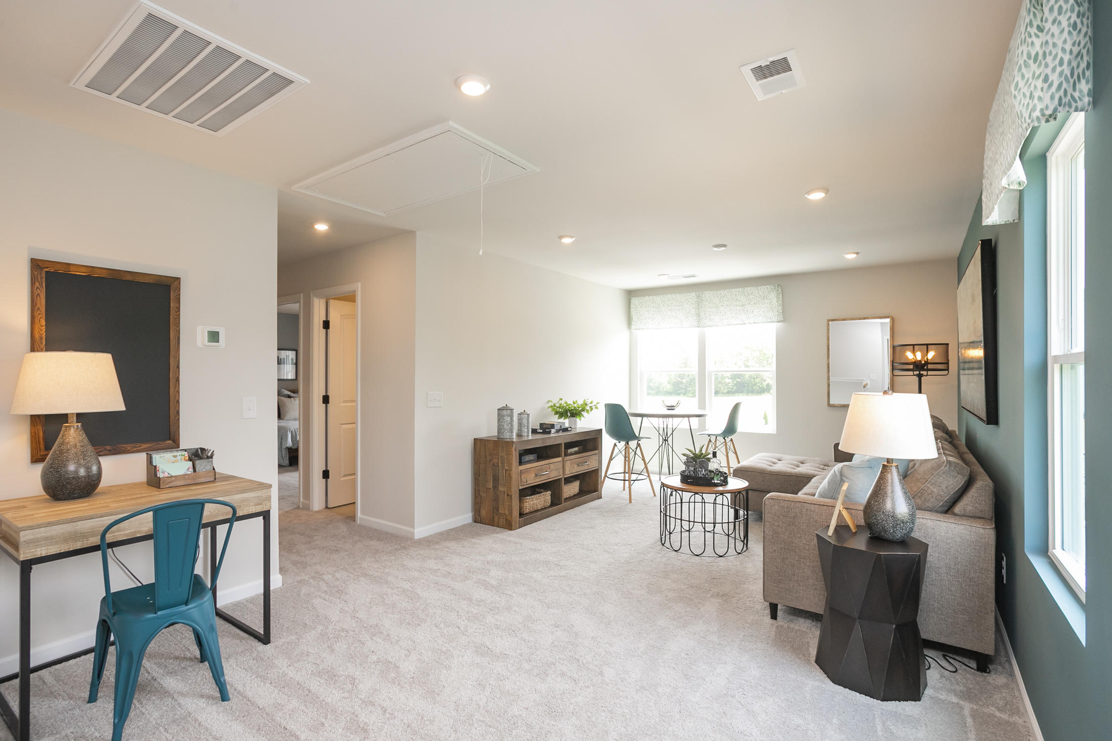 A living room with a couch and a table.