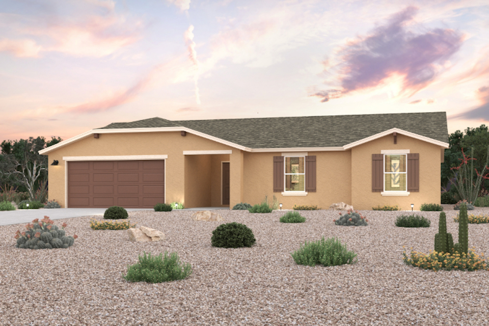 A house with a gravel driveway.