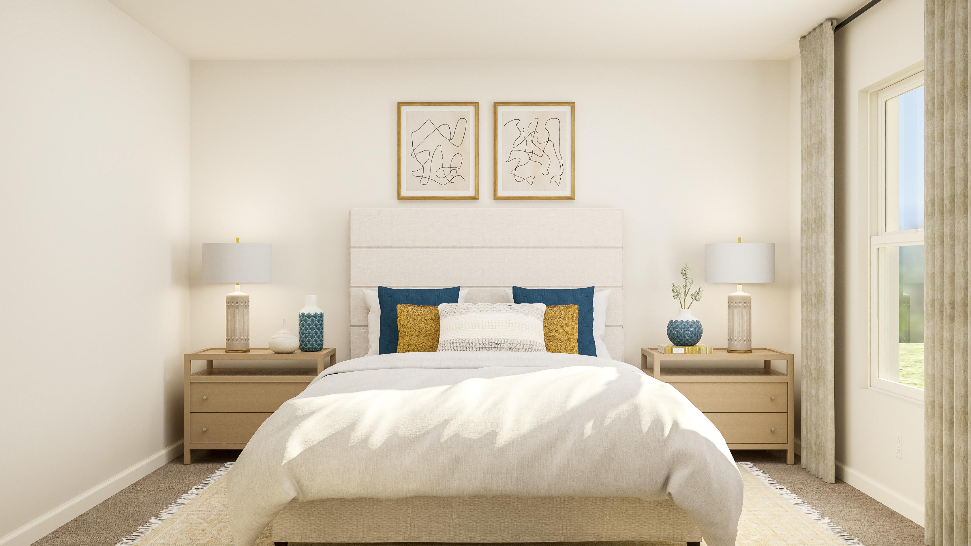 A bedroom with a bed and lamps.