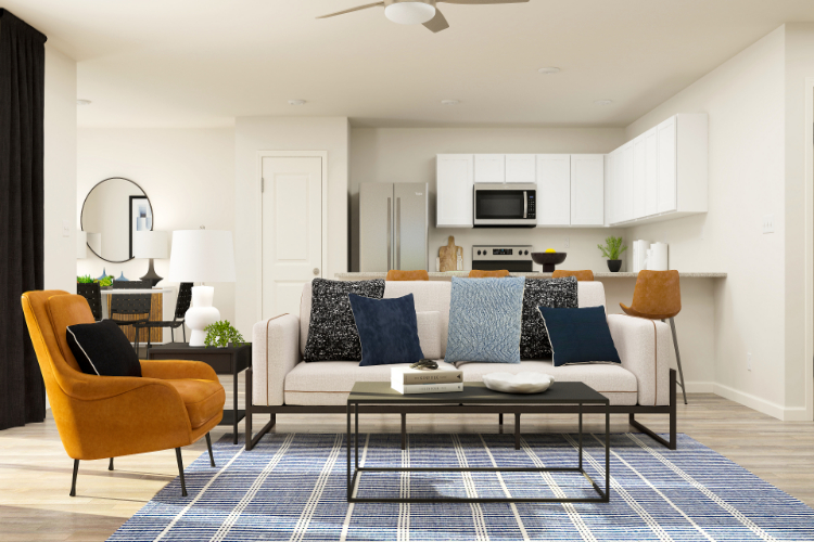 A living room with a couch and a table.