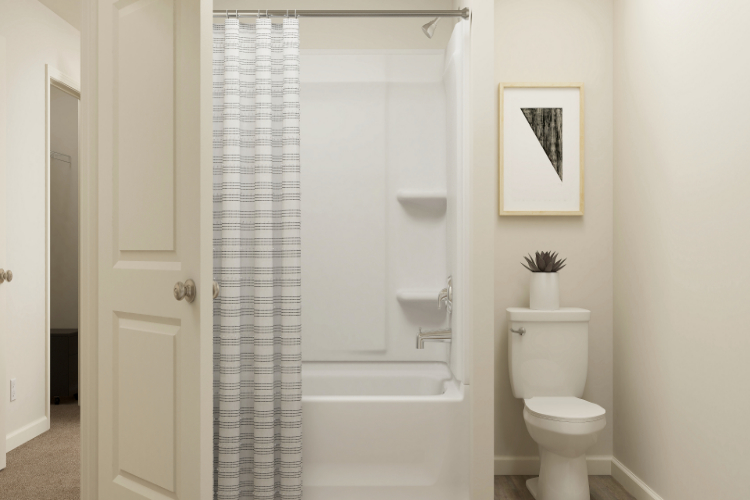 A bathroom with a shower curtain.