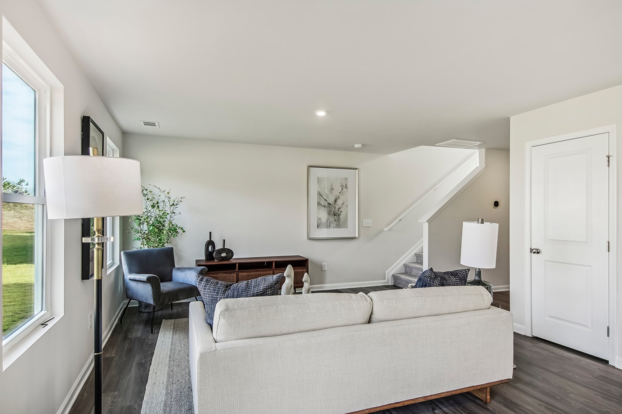 A living room with a couch and a table.